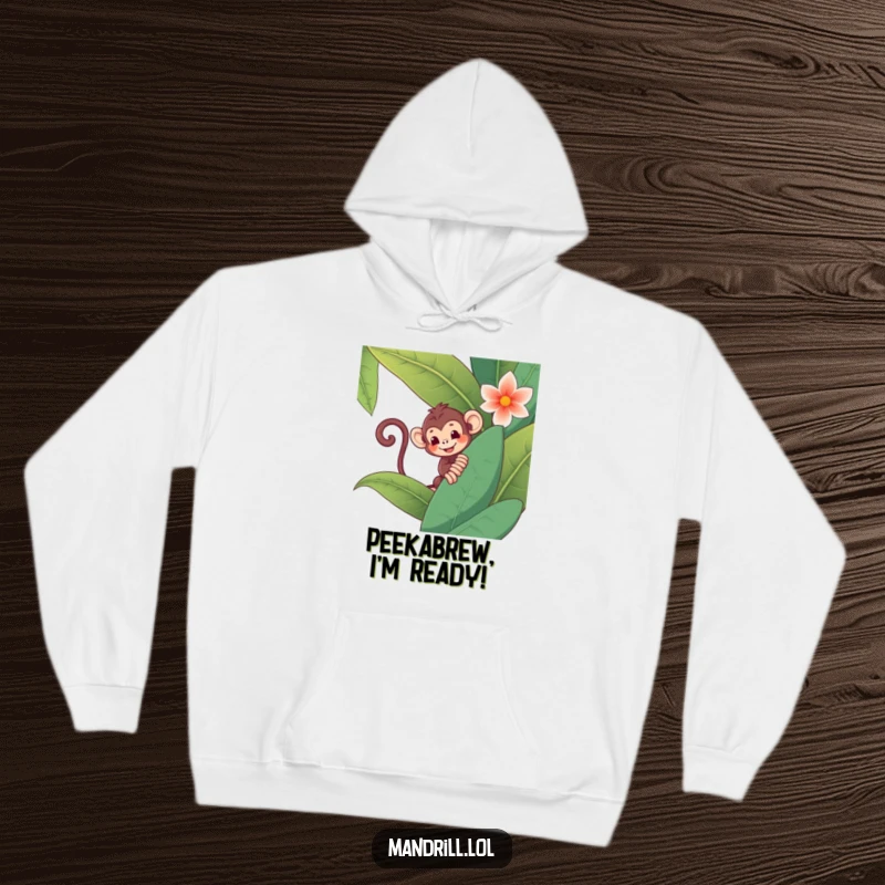 Funny Monkey Hoodie: A mischievous monkey with a curly tail peeks out from behind a large jungle flower, showing playful spirit.